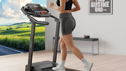 Person running on a treadmill with a scenic landscape displayed.